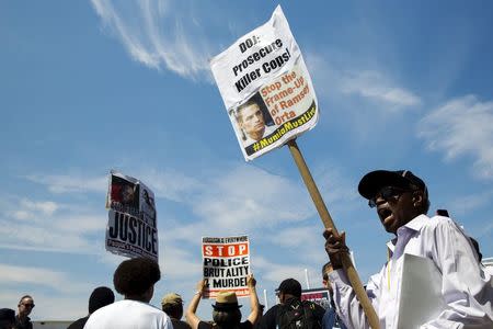 Demonstrators protest as they march to the location where Eric Garner was killed on the one year anniversary of his death in New York, July 17, 2015. REUTERS/Lucas Jackson