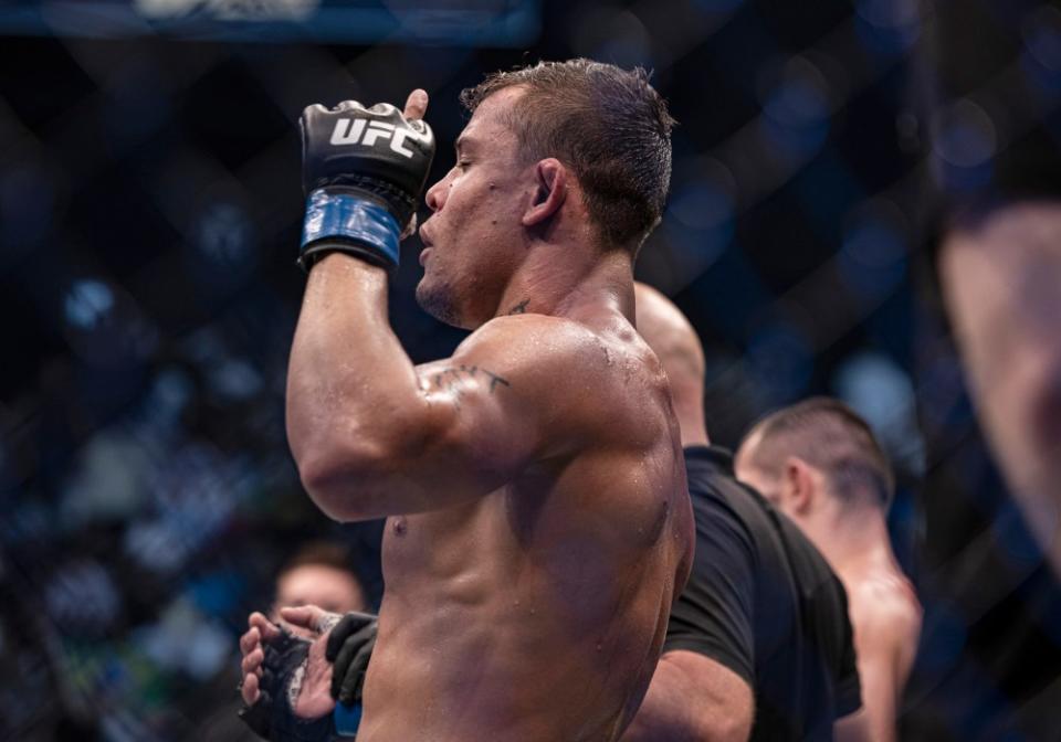 Oct 22, 2022; Abu Dhabi, UAE; Caio Borralho (blue gloves) defeats Makhmud Muradov (red gloves) during UFC 280 at Etihad Arena. Mandatory Credit: Craig Kidwell-USA TODAY Sports