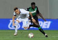 Soccer Football - Serie A - U.S Sassuolo v Inter Milan - Mapei Stadium – Citta del Tricolore, Reggio Emilia, Italy - August 19, 2018 Inter Milan's Lautaro Martinez in action with Sassuolo's Alfred Duncan REUTERS/Jennifer Lorenzini