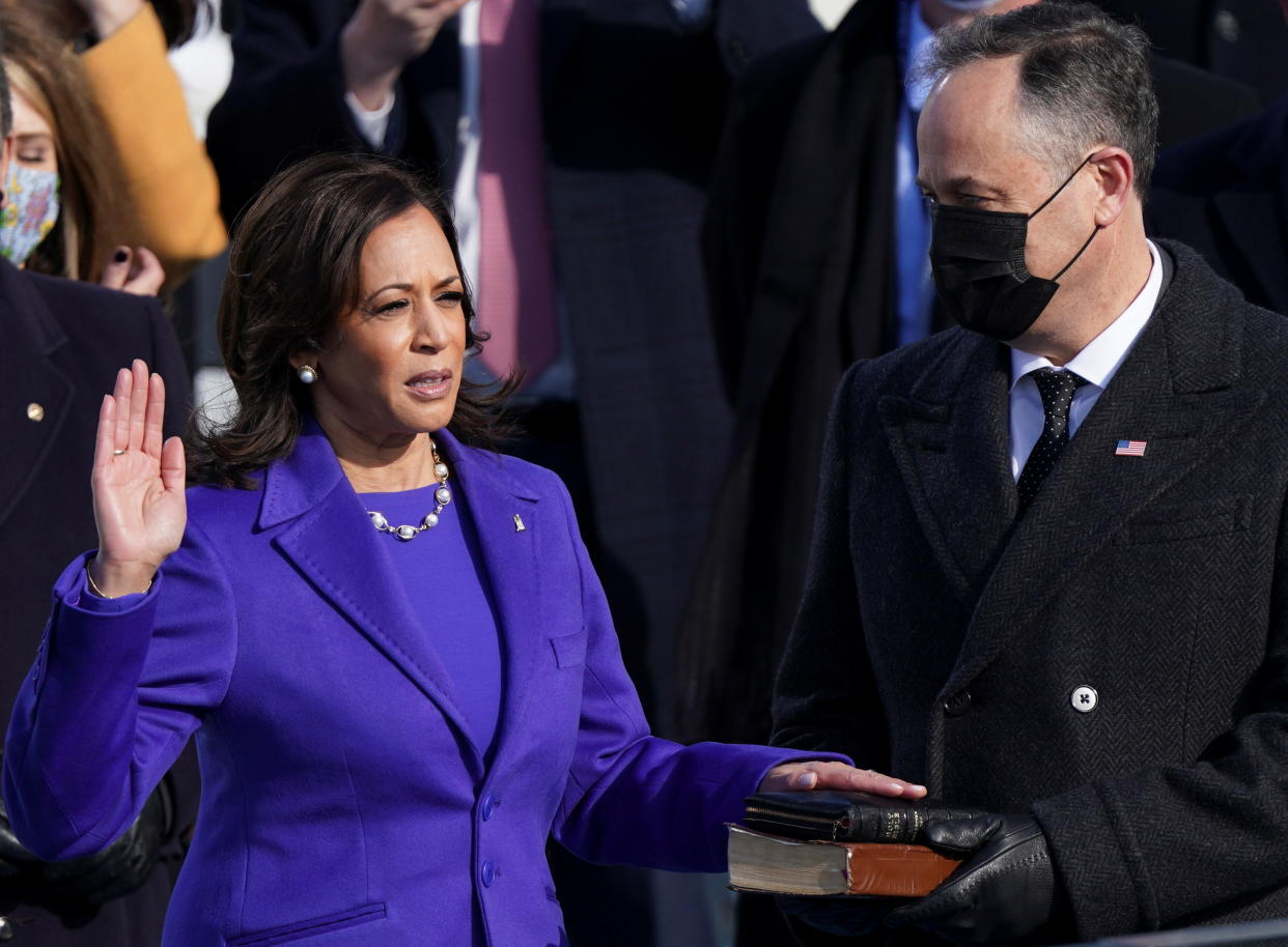 Kamala Harris is sworn in as U.S. Vice President as her spouse Doug Emhoff holds a bible during the inauguration of Joe Biden as the 46th President of the United States. (Kevin Lamarque/Reuters)