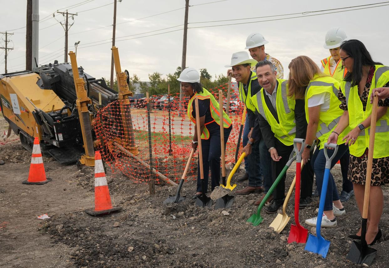 Round Rock Mayor Craig Morgan, in center of group, joins other officials at a groundbreaking ceremony Wednesday at Roundville Lane to celebrate the arrival of Google Fiber in the city.