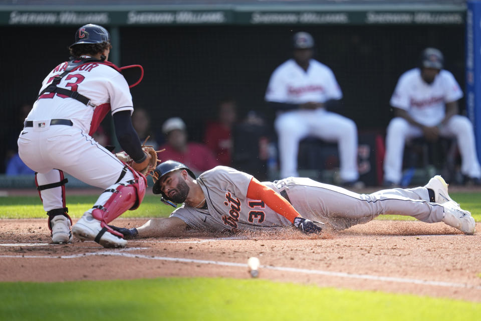 Detroit Tigers' Riley Greene (31) is tagged out by Cleveland Guardians catcher Bo Naylor, left, in the third inning in the first baseball game of a doubleheader, Friday, Aug. 18, 2023, in Cleveland. (AP Photo/Sue Ogrocki)