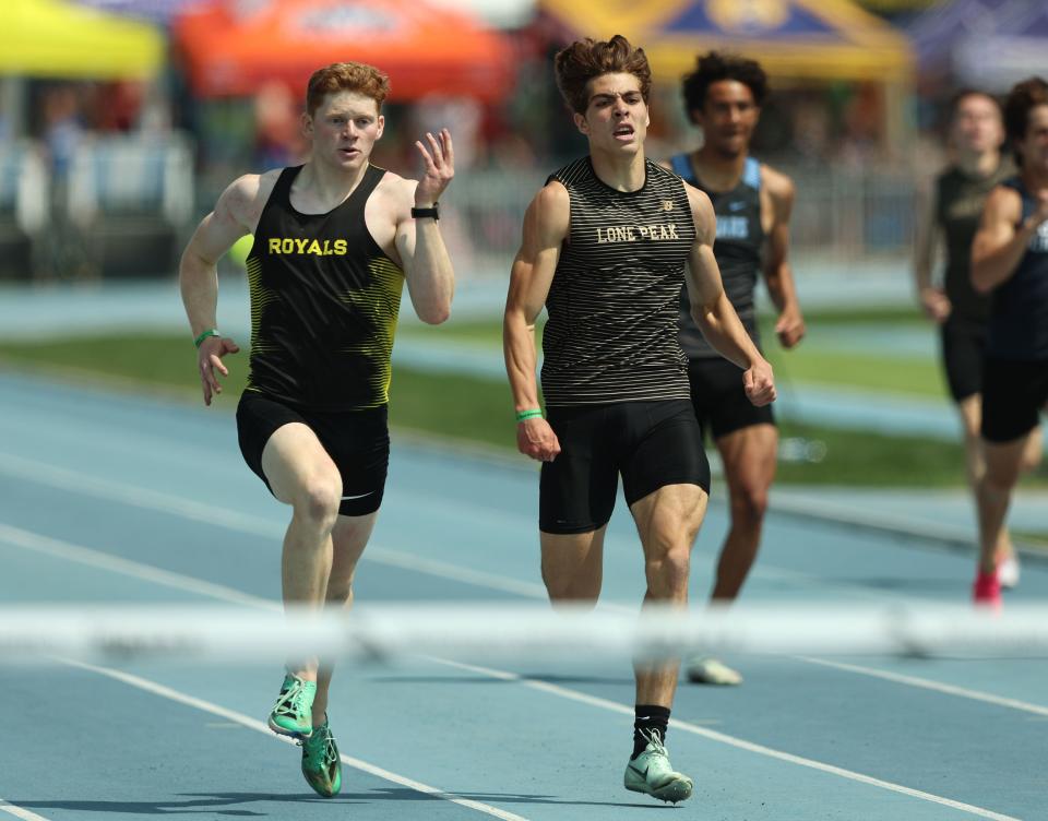 Roy’s Colby Anderson, edges ahead of Lone Peak’s Ethan Valletta to take the win in the 400m as High School athletes gather at BYU in Provo to compete for the state track and field championships on Saturday, May 20, 2023. | Scott G Winterton, Deseret News