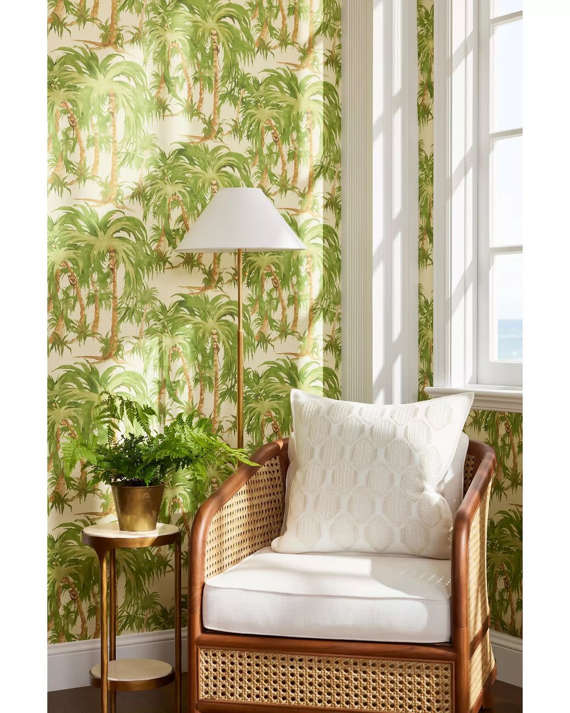 a chair with a lamp and plants