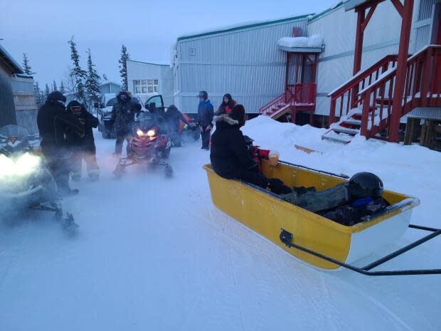 A group of students and staff at Chief Paul Niditchie School in Tsiigehtchic, N.W.T., get ready to spend some time out of the classroom on the land.