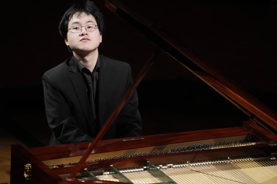 Canadian pianist Eric Guo plays Frederic Chopin's Concerto in F minor on a replica of a 1830 Pleyel piano during a concert marking the 19th century piano virutoso and composer's 214th birthday, in Warsaw, Poland, on Friday, March 1, 2024. Guo won a quintannual competition to play Chopin on period instruments organized by the Fryderyk Chopin Institute. (AP Photo/Czarek Sokolowski)