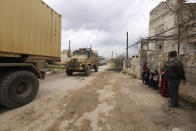 Turkish military convoy drives in Idlib province, Syria, Saturday, Feb. 22, 2020. A Turkish soldier was killed in Syria's northwest Idlib province, state-run Anadolu news agency reported Saturday. (AP Photo/Ghaith Alsayed)