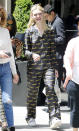 <p>The youngest Fanning sis stepped out in N.Y.C. in a pair of Prada racecar PJ's and crystal-buckle sneakers (shop a similar style <a rel="nofollow noopener" href="https://www.farfetch.com/shopping/women/maison-margiela-embellished-buckle-sneakers-item-11799810.aspx?" target="_blank" data-ylk="slk:here;elm:context_link;itc:0;sec:content-canvas" class="link ">here</a>). </p>