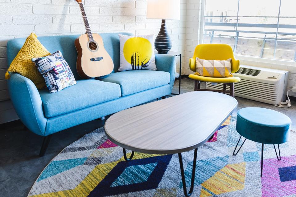 The seating area of a guest room at the reimagined Egyptian Motor Hotel on Grand Avenue in Phoenix, which reopened in January 2023.