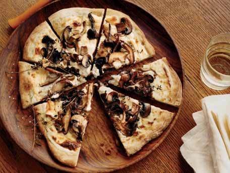 <strong>Get the <a href="http://www.huffingtonpost.com/2011/10/27/mushroom-and-goat-cheese-_n_1058572.html">Mushroom and Goat Cheese Béchamel Pizzas</a> recipe</strong>