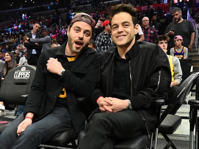 <p>Adam Pantozzi/NBAE/Getty</p> Sami Malek and Rami Malek at a game between the Los Angeles Lakers and the LA Clippers in 2022.