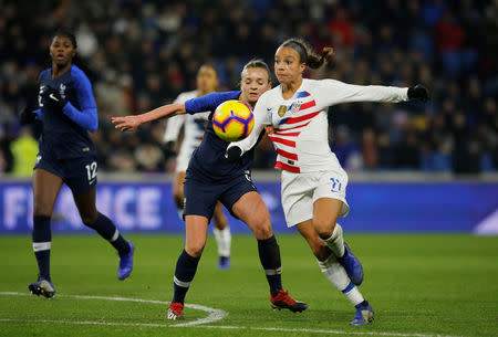 Soccer Football - Women's International Friendly - France v United States - Stade Oceane, Le Havre, France - January 19, 2019 Mallory Pugh of U.S. in action with France's Marion Torrent REUTERS/Pascal Rossignol