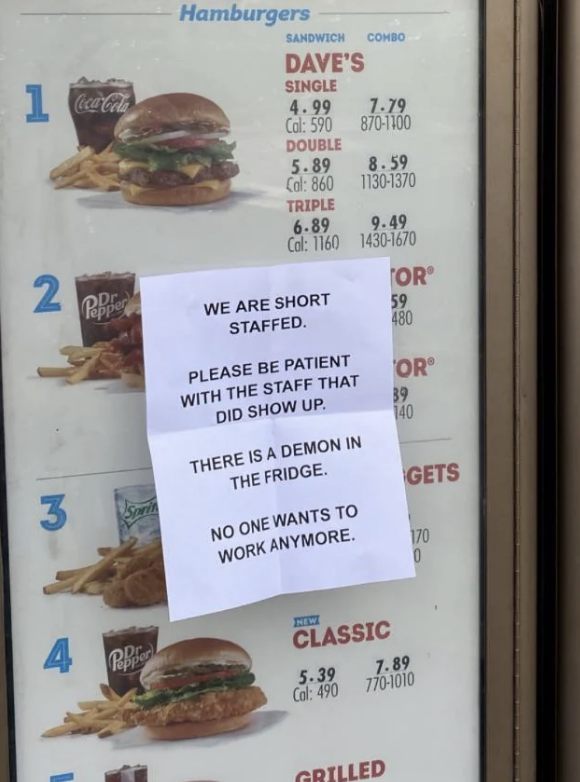 Fast food menu with a humorous sign: "We are short staffed. Please be patient with the staff that did show up. There is a demon in the fridge. No one wants to work anymore."