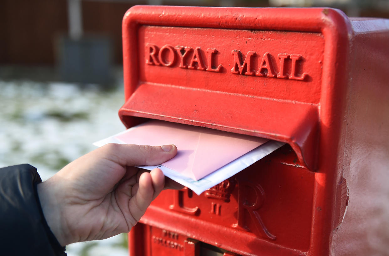 BRADFORD-ENGLAND- FEBRUARY 11: Letters are posted into a Royal Mail post box on February 11, 2021 in Bradford, England . (Photo by Nathan Stirk/Getty Images)