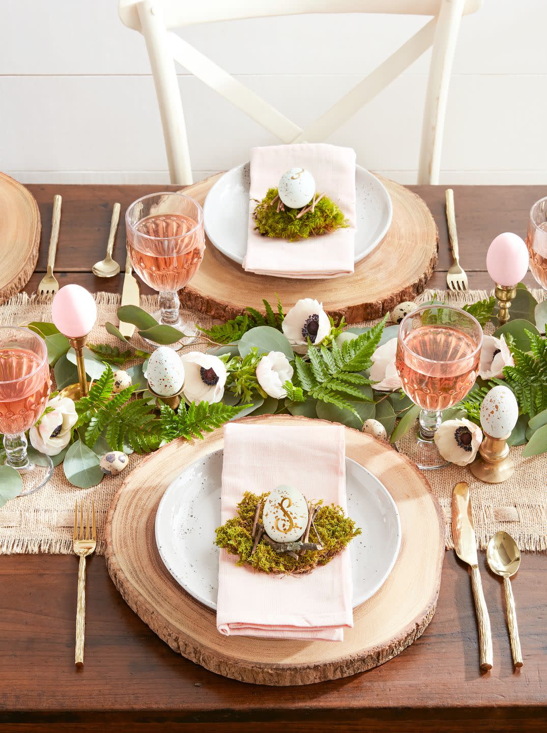 table with yellow tablecloth, dishes, and chickens