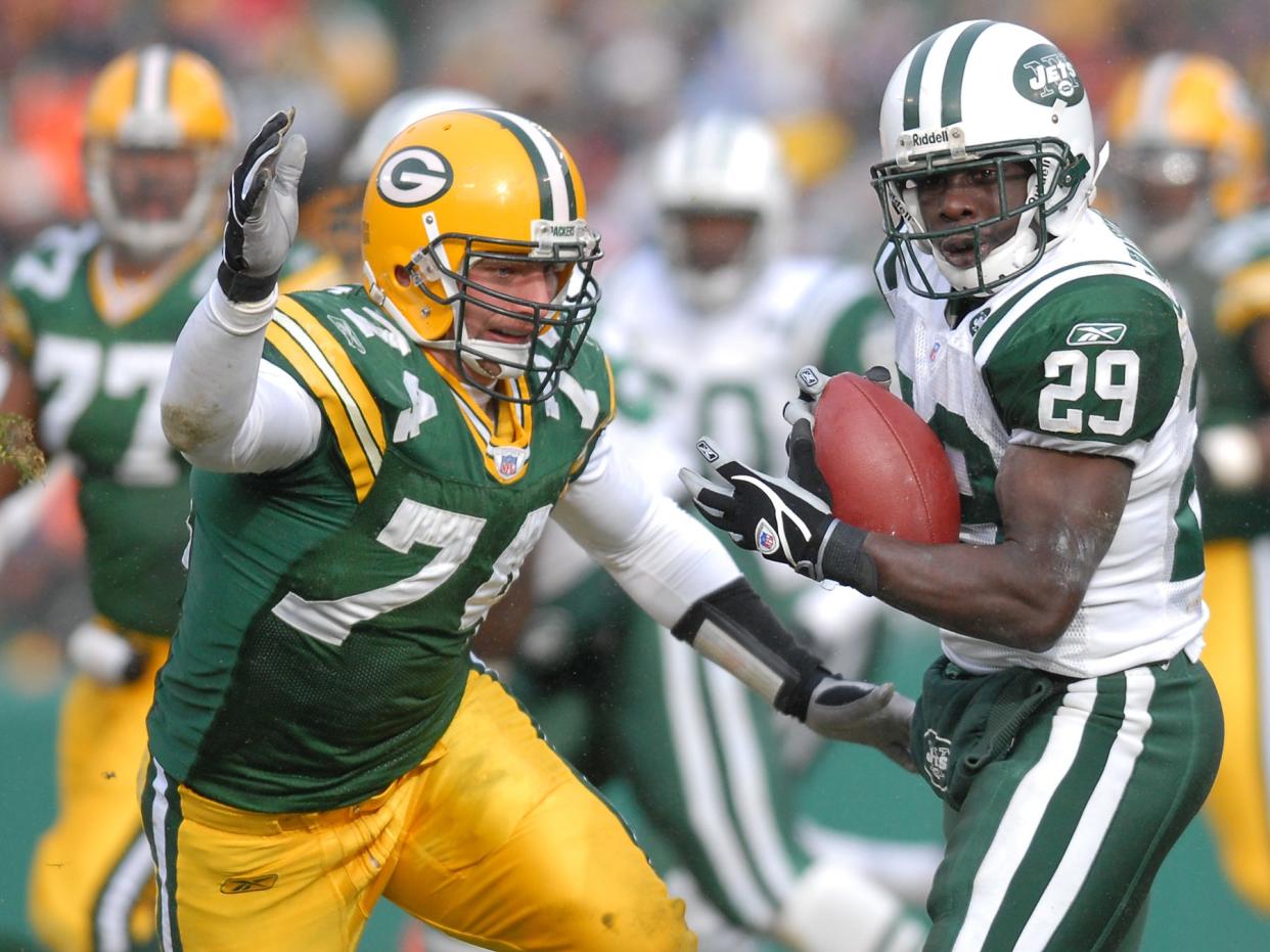 Packers defensive end Aaron Kampman chases New York Jets running back Leon Washington on a pass play during the Packers' 38-10 loss to the Jets on Dec. 3, 2006, at Lambeau Field in Green Bay.