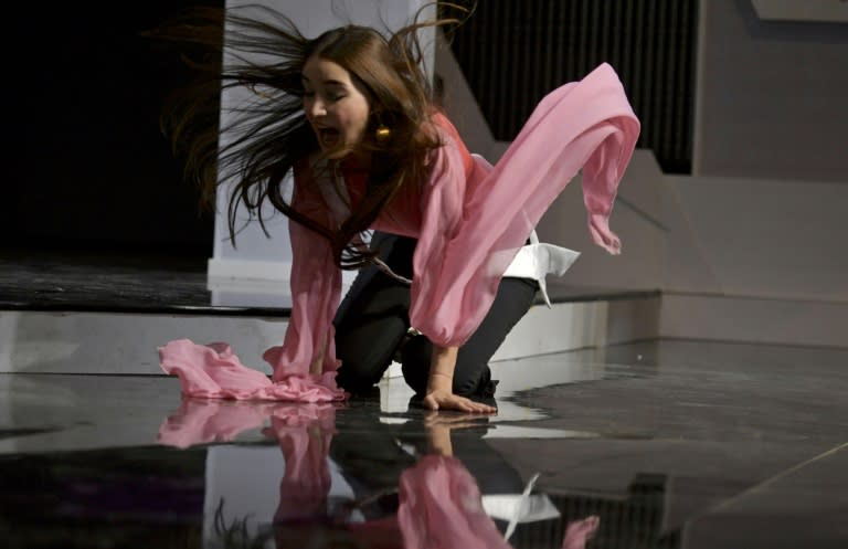 Venezuela' Vargas state contestant, Juliette Lemoine, stumbles during a rehearsal for the Miss Venezuela beauty contest, in Caracas, Venezuela on December 11, 2018