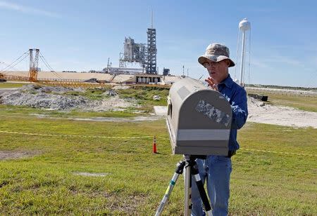 Orlando Sentinel photographer Red Huber sets up remote cameras as a SpaceX Falcon 9 rocket, in a horizontal position, is readied for launch on a supply mission to the International Space Station on historic launch pad 39A at the Kennedy Space Center at Cape Canaveral, Florida, U.S., February 17, 2017. The launch is scheduled for February 18. REUTERS/Joe Skipper