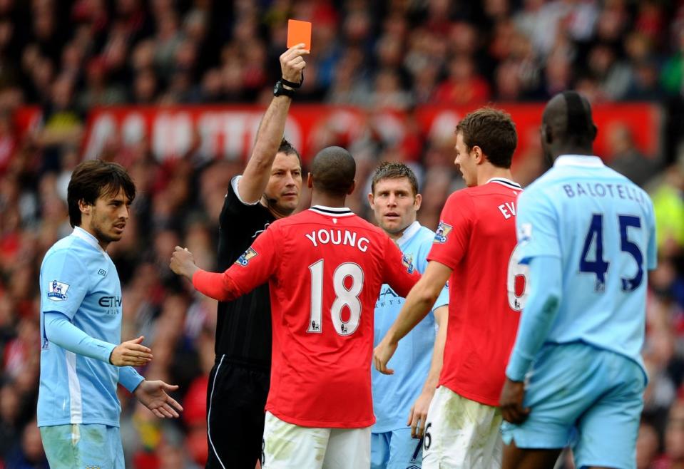 Referee  Mark Clattenburg shows a red card to Jonny Evans of Manchester United in 2011 (Getty Images)