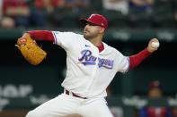 Texas Rangers starting pitcher Martin Perez throws to the Philadelphia Phillies in the first inning of a baseball game, Tuesday, June 21, 2022, in Arlington, Texas. (AP Photo/Tony Gutierrez)