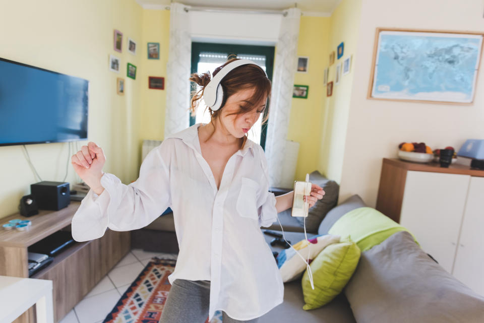 Woman dancing alone in her home