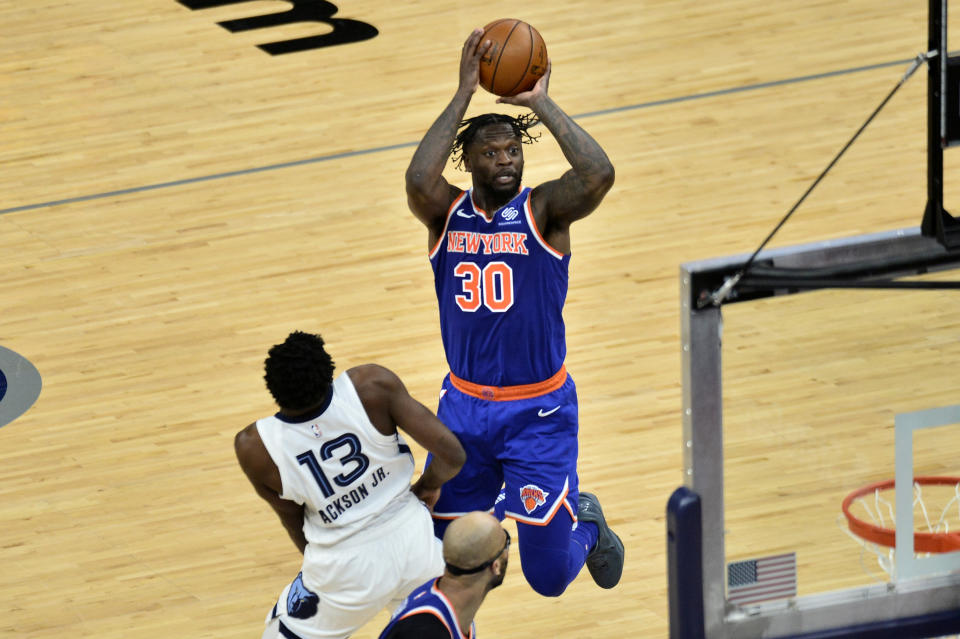 New York Knicks forward Julius Randle (30) shoots against Memphis Grizzlies forward Jaren Jackson Jr. (13) in the second half of an NBA basketball game Monday, May 3, 2021, in Memphis, Tenn. (AP Photo/Brandon Dill)