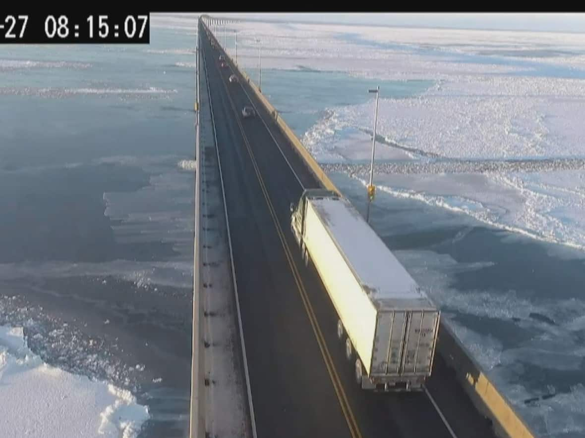 Trucks and other vehicles gathered in Borden-Carleton Thursday morning before heading across the Confederation Bridge.  (Confederation Bridge - image credit)