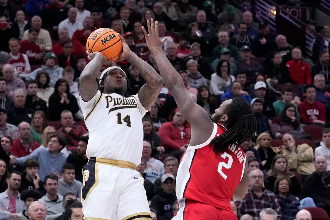 Purdue’s David Jenkins Jr. (14) shoots overOhio State’s Bruce Thornton (2) during the second half of an NCAA semifinal basketball game at the Big Ten men’s tournament, Saturday, March 11, 2023, in Chicago. (AP Photo/Charles Rex Arbogast)