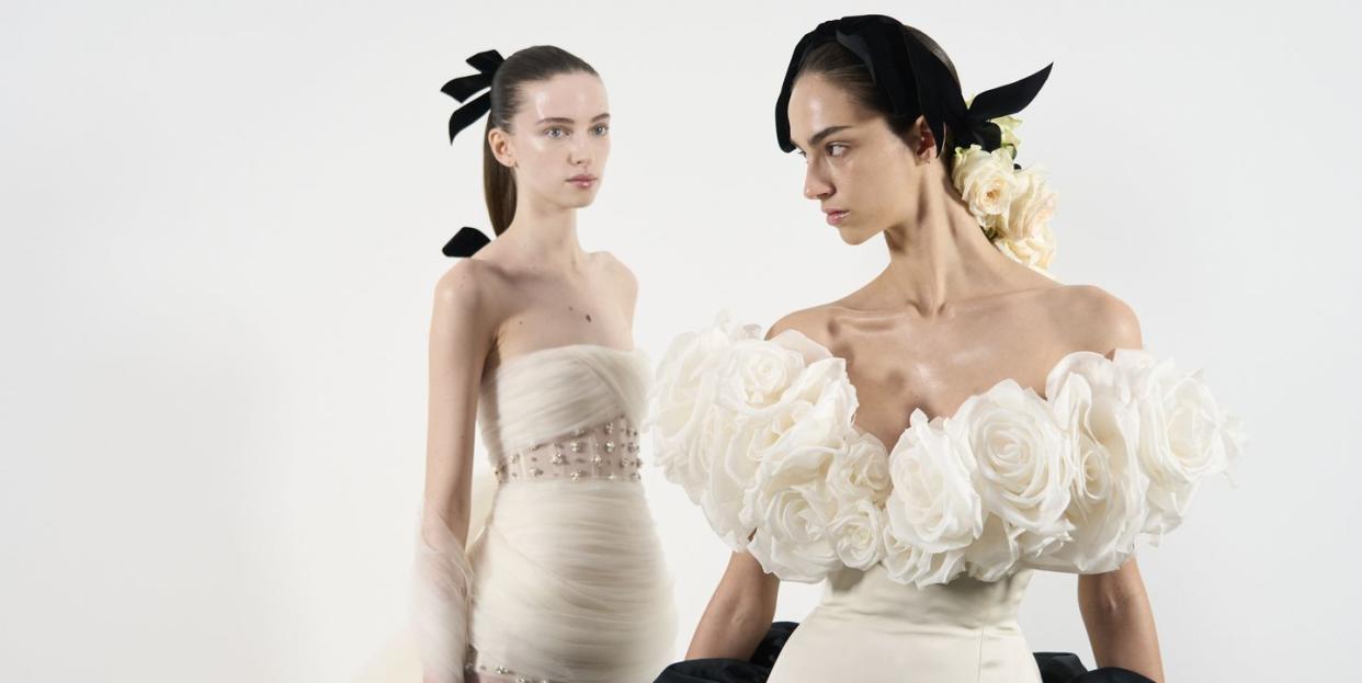 a couple of women in wedding dresses