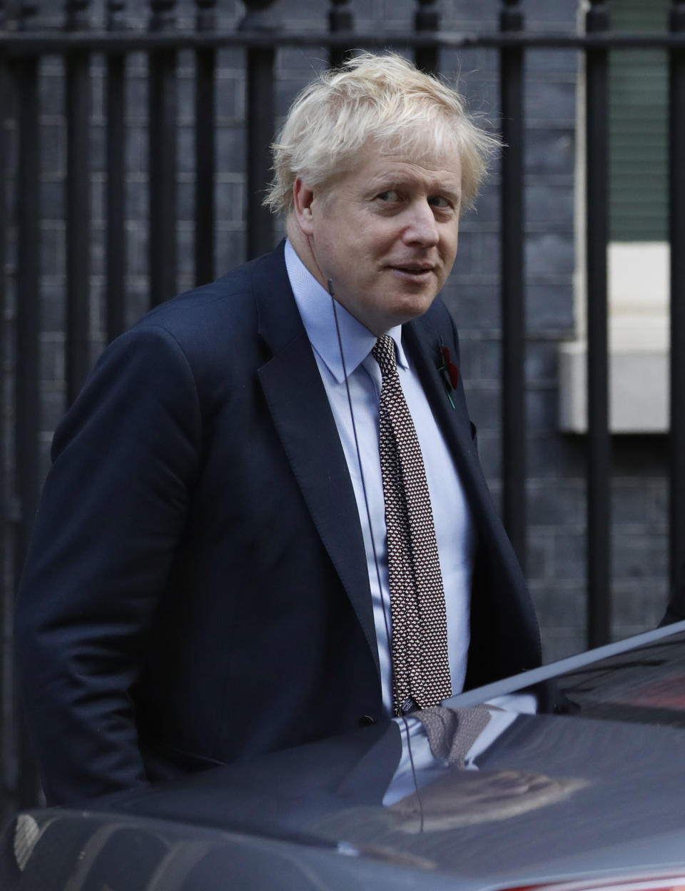 Britain's Prime Minister Boris Johnson leaves 10 Downing Street on route to Buckingham Palace ahead of an audience with Queen Elizabeth II and the formal start of the General Election, in London, Wednesday, Nov. 6, 2019. Britain goes to the polls on Dec.12. (AP Photo/Alastair Grant)