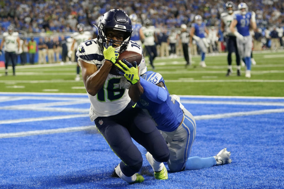 Seattle Seahawks wide receiver Tyler Lockett (16) catches a 3-yard touchdown pass in front of Detroit Lions cornerback Jerry Jacobs during the second half of an NFL football game, Sunday, Sept. 17, 2023, in Detroit. (AP Photo/Paul Sancya)