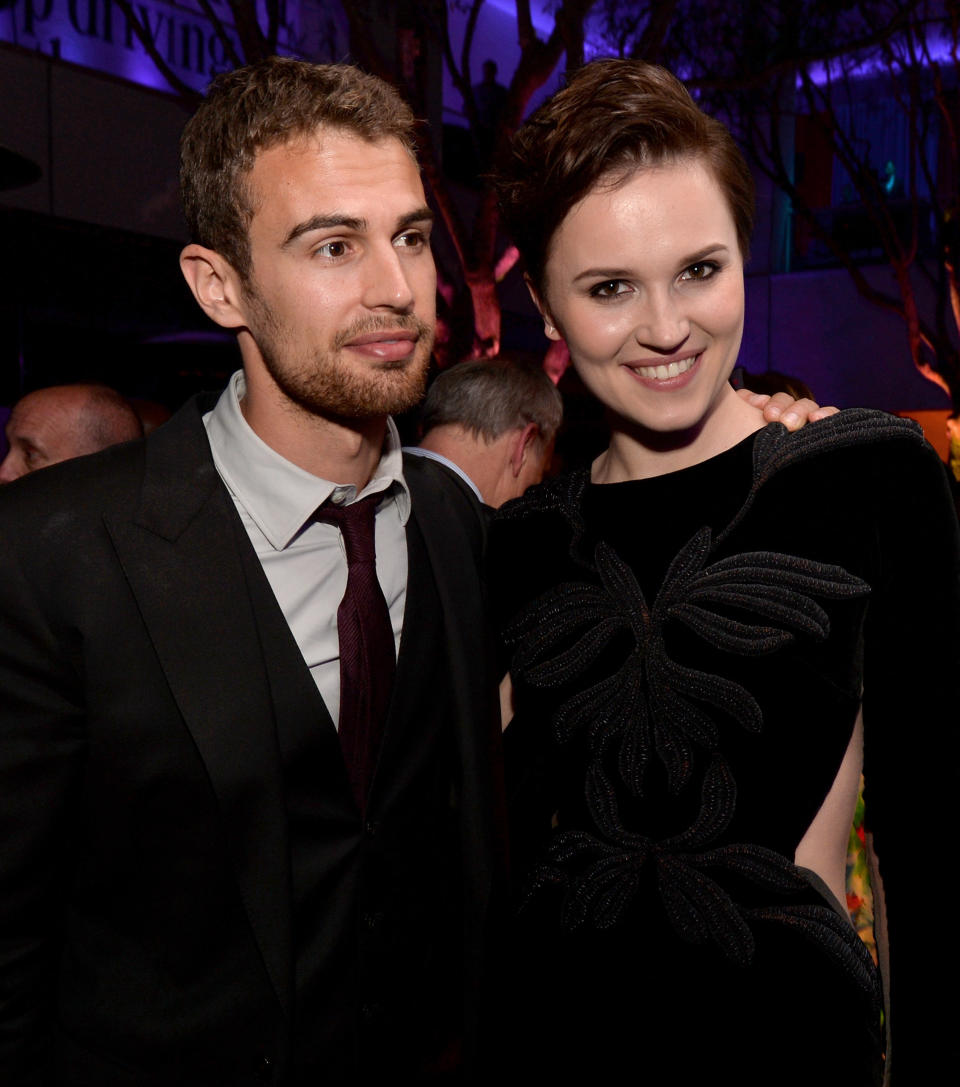 LOS ANGELES, CA - MARCH 18:  Actor Theo James (L) and writer Veronica Roth pose at the after party for the premiere of Summit Entertainment's 'Divergent' at The Armand Hammer Museum on March 18, 2014 in Los Angeles, California.  (Photo by Kevin Winter/Getty Images)