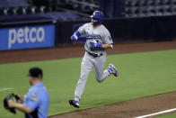 Los Angeles Dodgers left fielder A.J. Pollock reacts after hitting a home run during the ninth inning of the team's baseball game against the San Diego Padres, Tuesday, Aug. 4, 2020, in San Diego. (AP Photo/Gregory Bull)