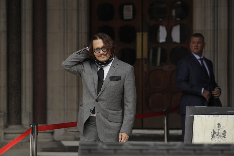 American actor Johnny Depp poses for the media as he arrives at the High Court in London, Monday, July 13, 2020. Depp is expected to wrap up his evidence at his libel trial against a tabloid newspaper that accused him of abusing ex-wife Amber Heard. The Hollywood star is suing News Group Newspapers, publisher of The Sun, and the paper’s executive editor, Dan Wootton, over an April 2018 article that called him a “wife-beater.” (AP Photo/Matt Dunham)