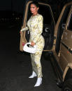 <p>Kylie Jenner stuns in a yellow dress and white boots as she arrives at Nobu for dinner in West Hollywood on Thursday.</p>