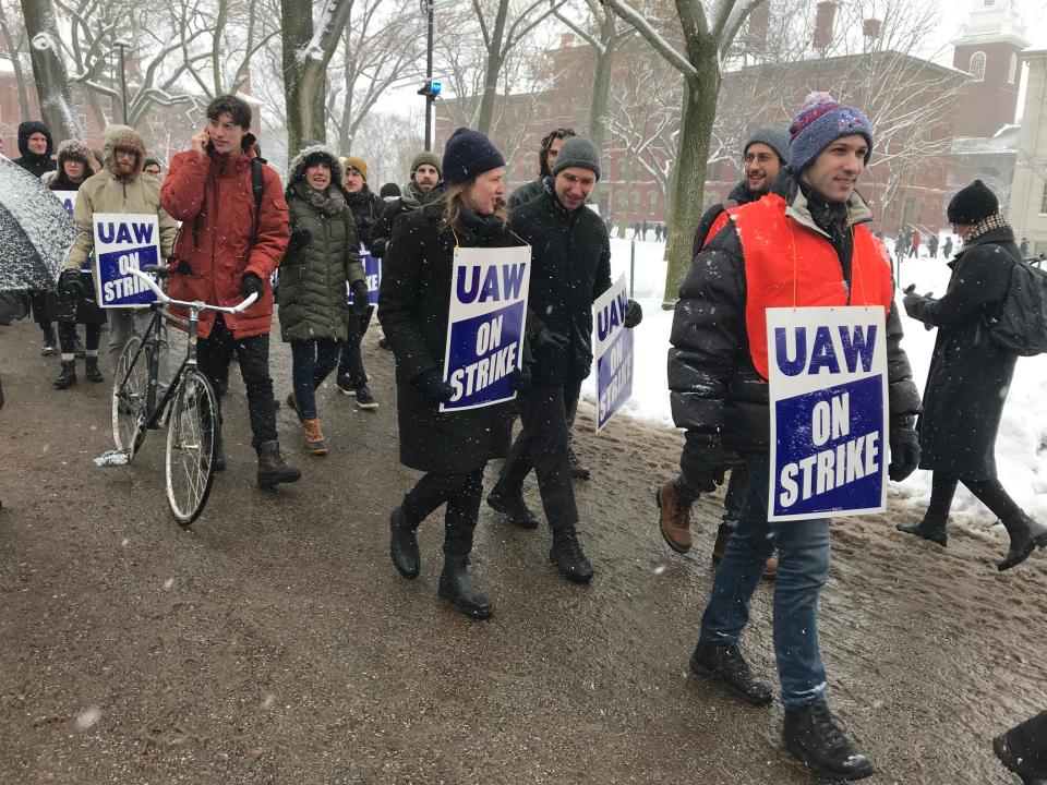 Harvard University graduate student workers picket at Harvard Yard Tuesday as they go on strike.