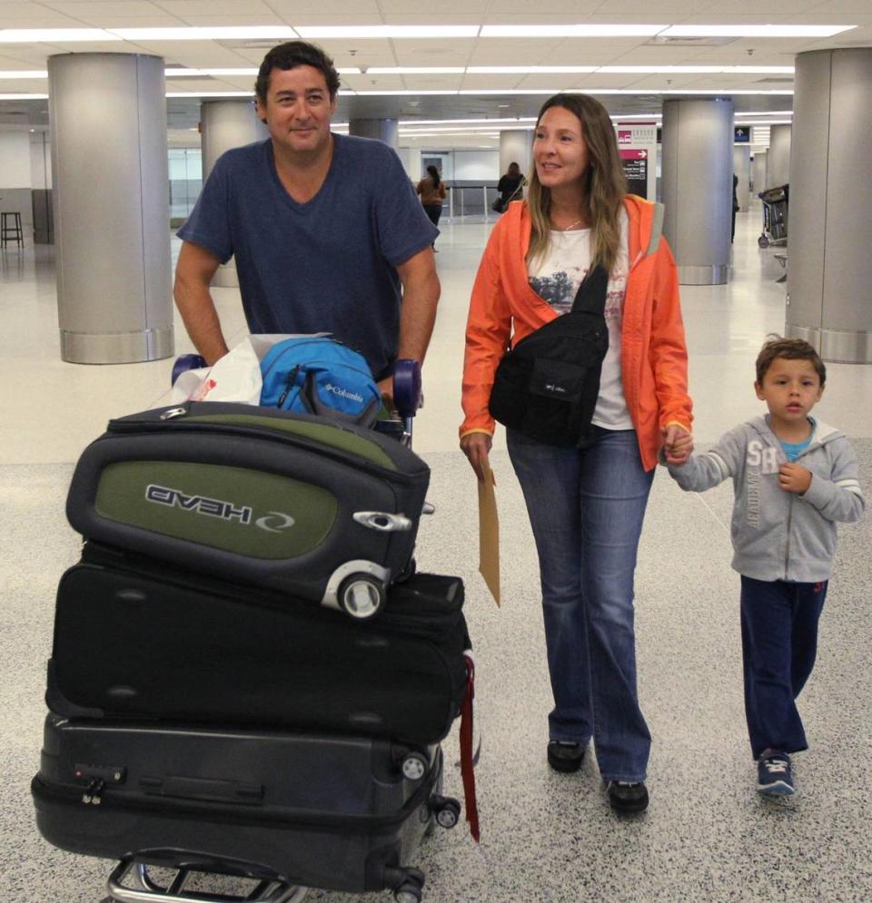 (Left to right) Chilean tourists, Hugo Larraguibel, Viviana Contardo, their son IÂ-aki, 4 year old, arrive at Miami International Airport from Punta Cana, Dominican Republic, on Tuesday, February 18, 2014. The State Department says it will facilitate the process of delivery of visas to foreign tourists and promote U.S. tourist sites such as the Everglades park to attract more visitors from abroad.