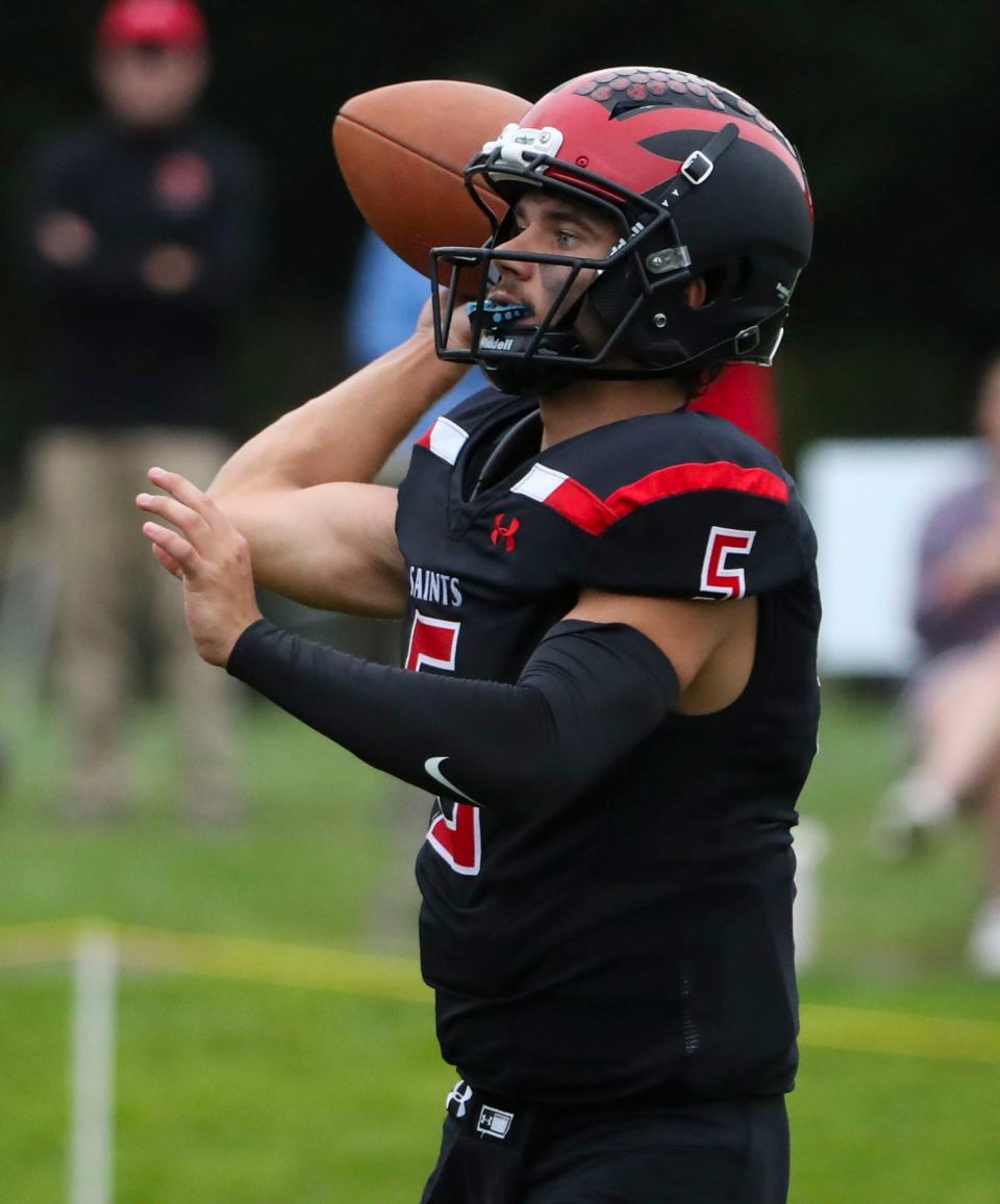 St. Andrew's Frank Nasta makes a pass in the second half of the Saints' 42-6 win against Early College School at St. Andrew's School in Middletown, Friday, Sept. 22, 2023.