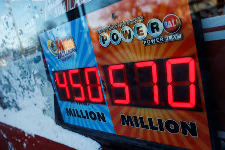 A sign advertising the Powerball lottery draw is seen outside a store in Port Washington, New York, U.S. January 5, 2018. REUTERS/Shannon Stapleton