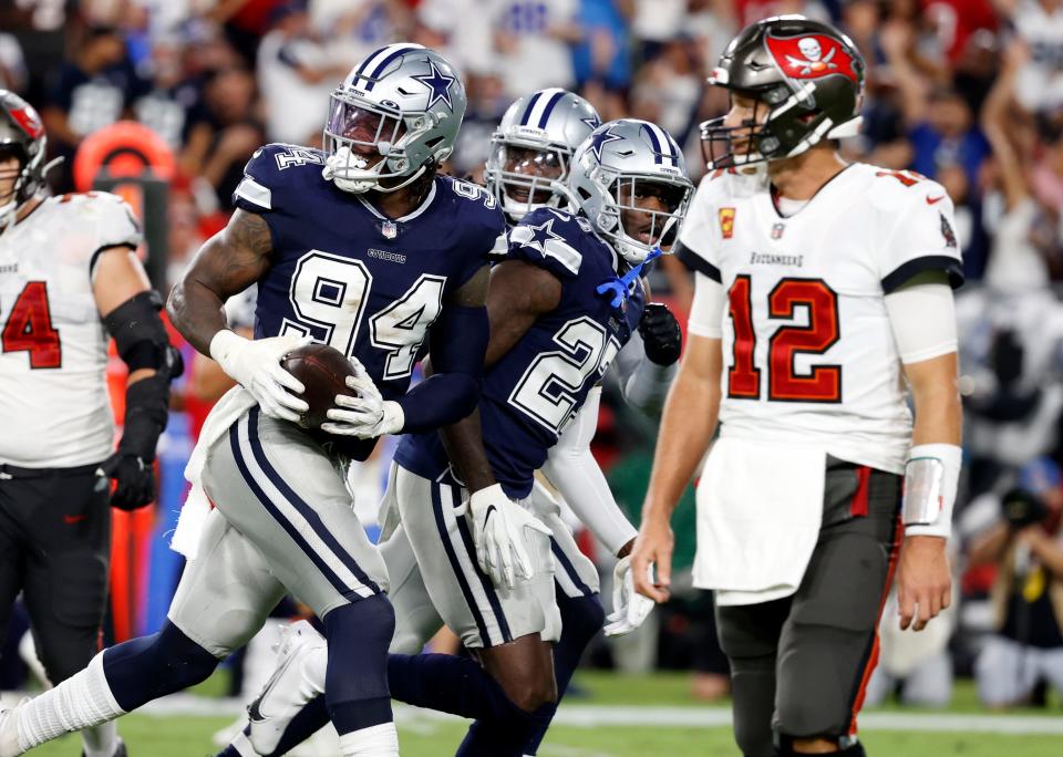 Cowboys defensive end Randy Gregory (94) reacts after recovering the ball against the Buccaneers on Thursday.