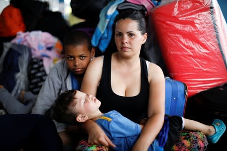 The Wider Image: Venezuelan mothers, children in tow, rush to migrate