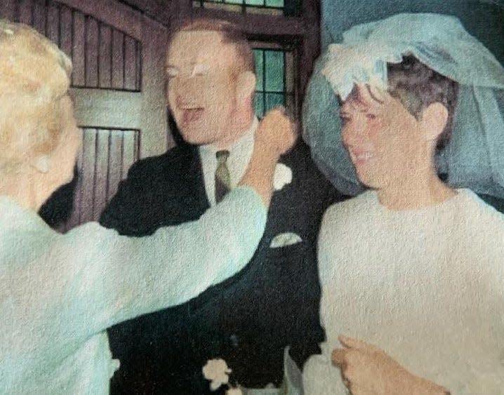 Louise Long congratulates her son Bud and daughter-in-law Ginger on their wedding day Aug. 19, 1967, in Alpena, Michigan.