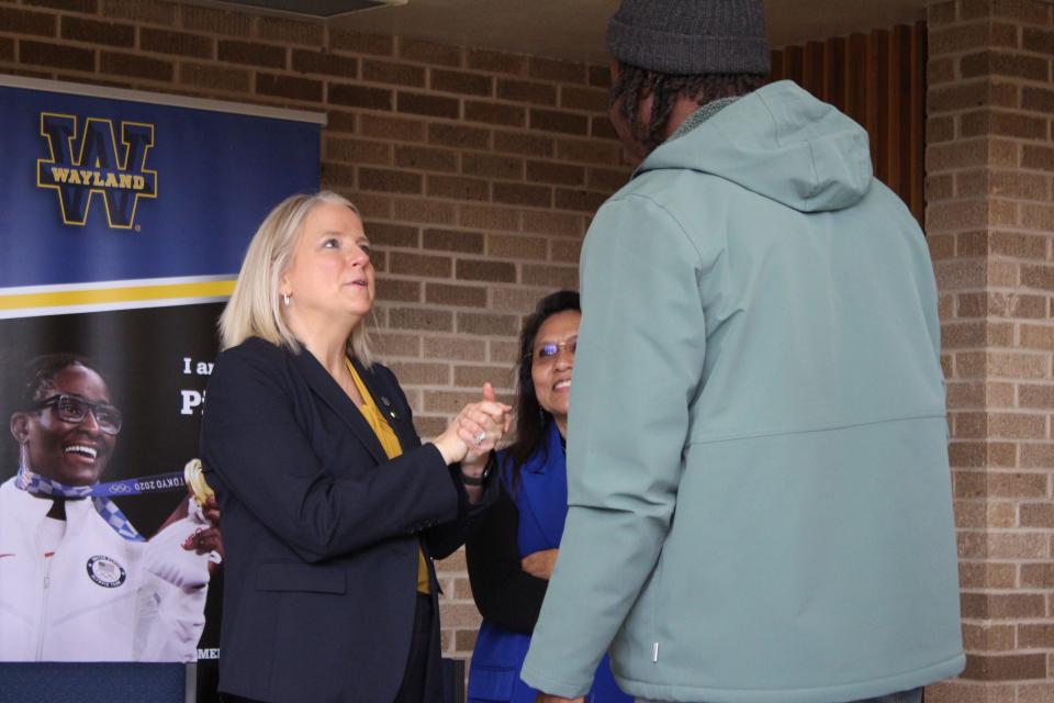 Donna Hedgepath, left, president-elect of Wayland Baptist University, speaks with students and staff at a reception Friday in Plainview.