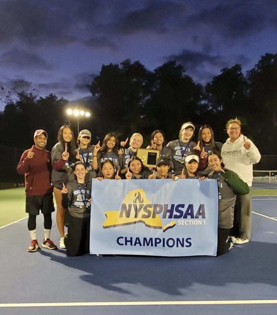 The Scarsdale girls tennis team poses after beating Horace Greeley Sunday to win its third straight Section 1 large-school team competition.
