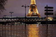 <p>A view shows the flooded banks of the Seine River and the Eiffel Tower after days of rainy weather in Paris, France, Jan. 23, 2018. (Photo: Gonzalo Fuentes/Rueters) </p>