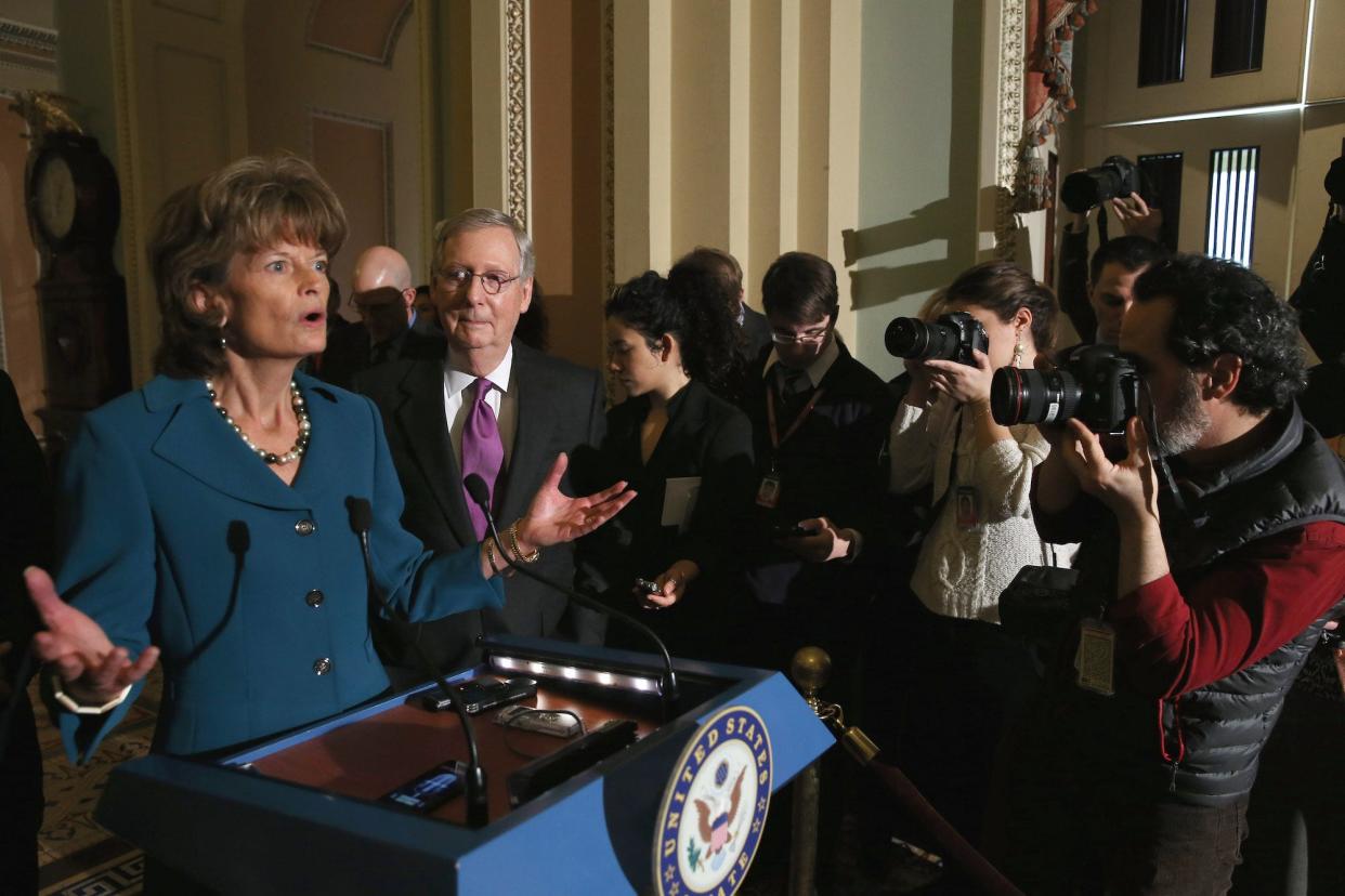 Republican Sen. Lisa Murkowski of Alaska speaks to reporters at the US Capitol while flanked by then-Majority Leader Mitch McConnell following the GOP's weekly policy luncheons on January 29, 2015 in Washington, DC.