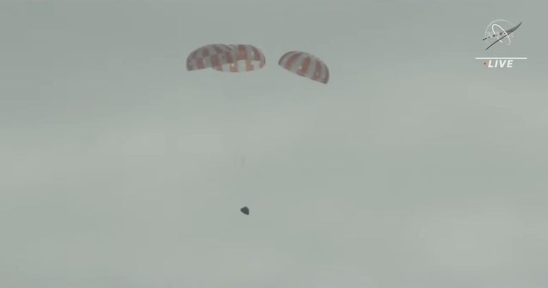 The first view of Orion during its parachute-assisted descent.