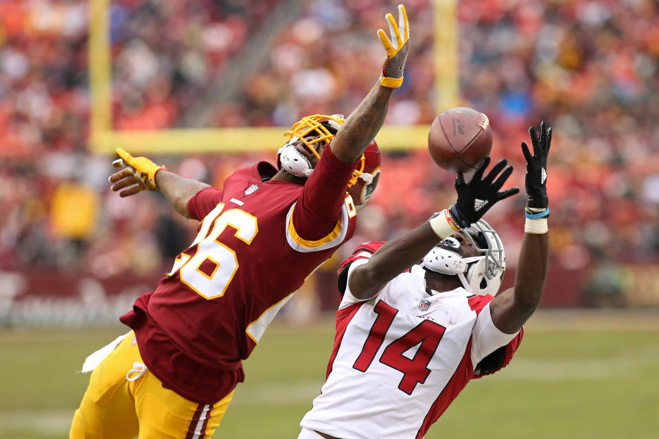 <p>Arizona Cardinals wide receiver J.J. Nelson (14) attempts to make a catch as Washington Redskins cornerback Bashaud Breeland (26) defends in the fourth quarter at FedEx Field. The Redskins won 20-15. Mandatory Credit: Geoff Burke-USA TODAY Sports </p>