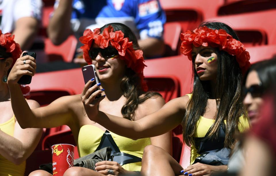 Ghana fans take selfies before the start of the 2014 World Cup Group G soccer match against Portugal at the Brasilia national stadium in Brasilia June 26, 2014. REUTERS/Dylan Martinez (BRAZIL - Tags: SOCCER SPORT WORLD CUP)