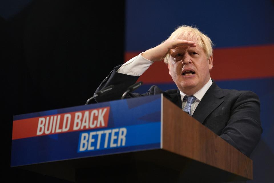 Britain's Prime Minister Boris Johnson delivers his keynote speech on the final day of the annual Conservative Party Conference at the Manchester Central convention centre in Manchester, northwest England, on October 6, 2021. (Photo by Oli SCARFF / AFP) (Photo by OLI SCARFF/AFP via Getty Images)